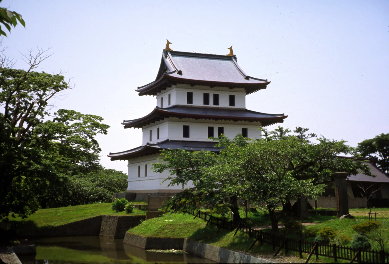 Matsumae Castle among trees and its moat